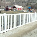 White vinyl closed picket fence in Cedar Hills, Utah